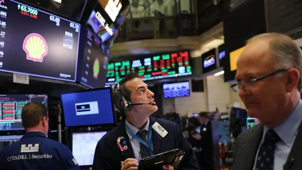 The sell-off across world stock markets on Monday sent investors rushing into the dollar, helping the US currency perform well against the euro, British pound and other commodity-linked currencies. (Jewel Samad/ AFP)