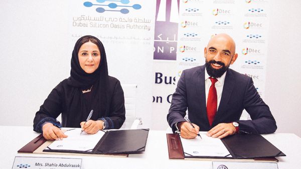 Shahla Ahmed Abdul Razak, deputy chief executive of DSOA, and Andrew Savvas, brand director of Volkswagen Middle East, during the signing ceremony. Shahla Ahmed Abdul Razak, deputy chief executive of DSOA, and Andrew Savvas, brand director of Volkswagen Middle East, during the signing ceremony.