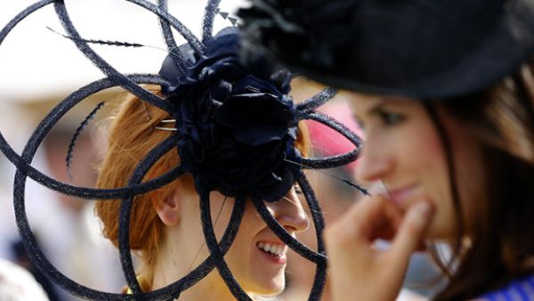 Guests wearing hats arrive at the Meydan racecourse to attend the Dubai World Cup day horse racing event in the United Arab Emirate of Dubai. (AFP/File)