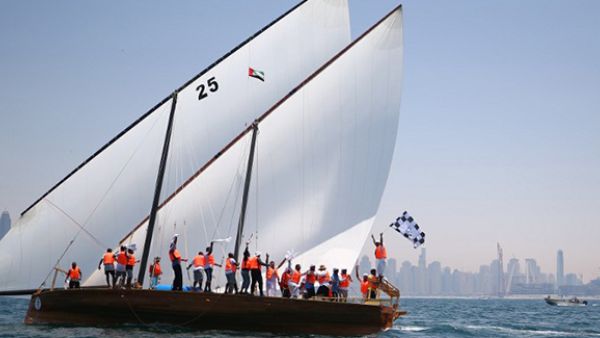 Emirati sailors on board the Zilzal celebrate after being crowned the champions of the Al-Gaffal traditional long-distance dhow sailing race between the island of Sir Bu Nair, near the Iranian coast. (AFP/File)