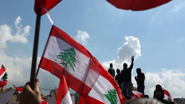 Lebanese wave their national flag in Beirut (AFP/File Photo)