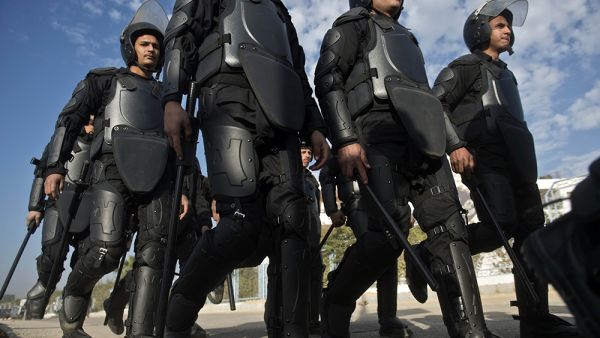 Egyptian riot policemen deploy to disperse supporters of Muslim Brotherhood ousted President Mohamed Morsi outside the police academy in Cairo on Wednesday, when the second hearing in his murder trial was to take place. (AFP/File)