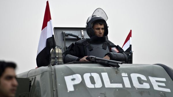 An Egyptian policeman stands guard from an armoured vehicle outside the venue of the trial of the ousted Islamist president Mohammed Morsi. (AFP/File)