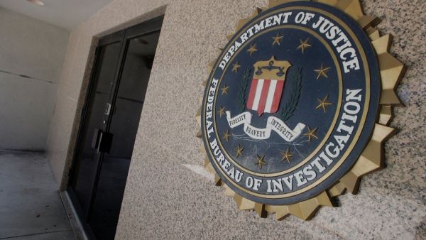 The FBI must work to improve its intelligence capabilities and information sharing to counter continuing threats, a report said Wednesday. (AFP/File)