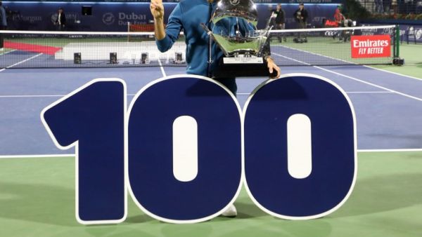 Switzerland's Roger Federer celebrates with the trophy after winning the final match at the ATP Dubai Tennis Championship in the Gulf emirate of Dubai on March 2, 2019. Roger Federer won his 100th career title when he defeated Greece's Stefanos Tsitsipas 6-4, 6-4 in the final of the Dubai Championships.
KARIM SAHIB / AFP