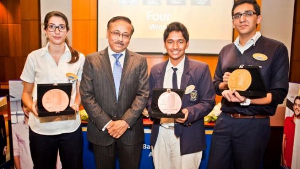 Winners of Emirates NBD Banker for a Day online competition with senior officials from the bank