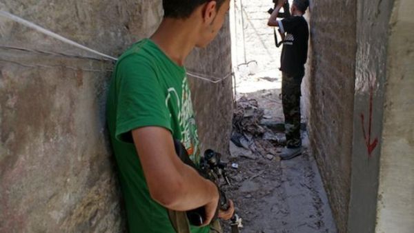 A picture from the opposition-run Shaam News Network shows rebel fighters in the northern city of Aleppo on June 24, 2013. (Source: AFP / HO / SHAAM NEWS NETWORK)