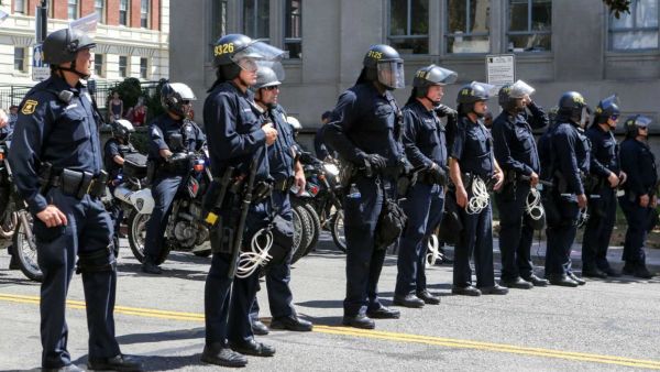 California police officers stand guard (AFP/File Photo)	