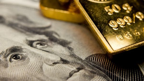 Gold hits one-month peak as dollar drops on uncertainty surrounding new US tax code. (Shutterstock)