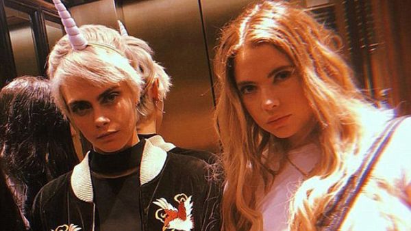 Cara and Ashley were spotted passionately kissing at Heathrow Airport  (Source: Ashleybenson / Instagram )