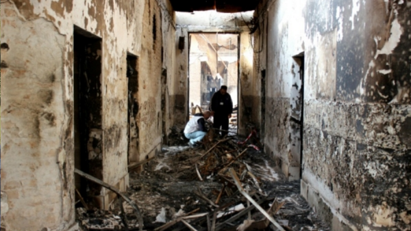 Staff investigate a Doctors Without Borders hospital in Afghanistan bombed by the US in October 2015. (AFP: Najim Rahim)