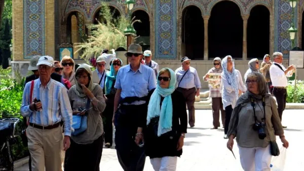 A photo shows foreign tourists visiting Tehran's Golestan Palace on August 5, 2015. (AFP/ Atta Kenare)