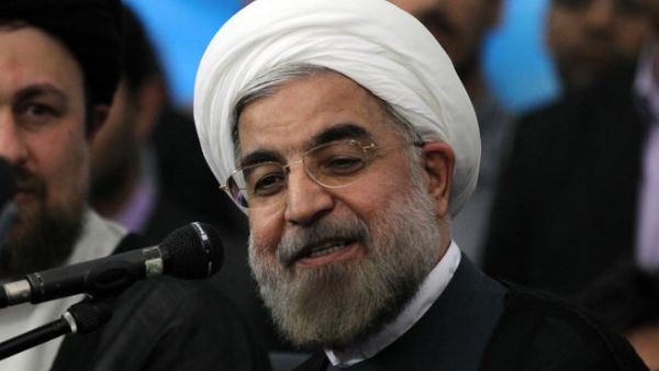 Iranian president-elect Hassan Rouhani speaks to the press following a visit to the Khomeini mausoleum, in Tehran on June 16 (Atta Kenare / AFP)
