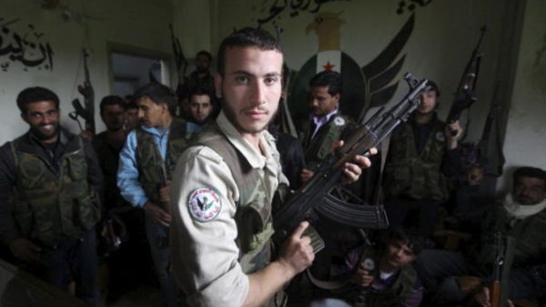 Free Syrian Army members at their base on April 21, 2013, in Darkoush, Syria. [Getty Images]