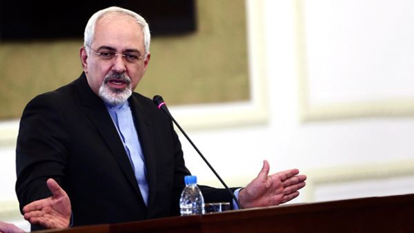 Iran's foreign minister issued a series of tweets late Thursday that protested US State Department's assertion that sanctions will be removed "in phases." (AFP/Behrouz Mehri)