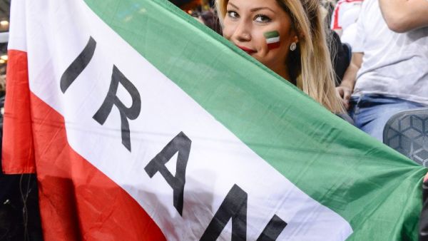 An Iranian supporter holds a flag during the friendly international football match between Sweden and Iran at the Friends Arena in Solna near Stockholm on March 31, 2015. (AFP/Jonathan Nackstrand) An Iranian supporter holds a flag during the friendly international football match between Sweden and Iran at the Friends Arena in Solna near Stockholm on March 31, 2015. (AFP/Jonathan Nackstrand)