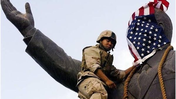 العصائب هددت بضرب القوات الأمريكية في حال لم تخرج