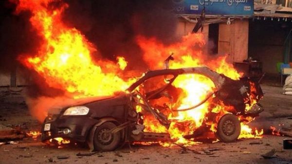 A blaze engulfs a car at the scene of an explosion in the Shiite Muslim Al-Amin district of Baghdad on December 8. [AFP]