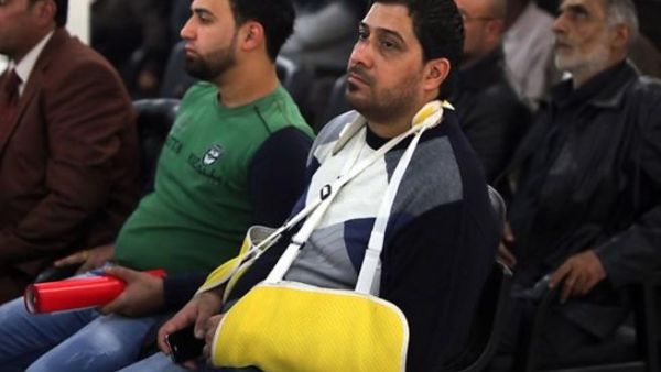 An Iraqi cafe owner injured in an bomb attack attends a seminar for owners. [resources1]