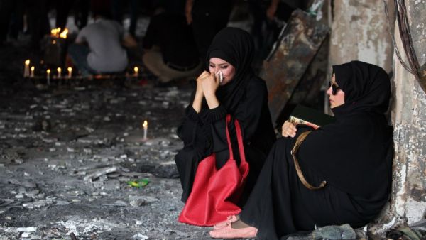 Iraqi women mourn the Karada suicide attack, days before another attack killed almost two dozen north of Baghdad. (AFP/Ahmad al-Rubaye)