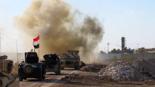 Iraqi pro-government forces drive their armored vehicles in the Jwaibah area, on the eastern outskirts of Ramadi, on February 8, 2016. (AFP/Moadh al-Dulaimi)