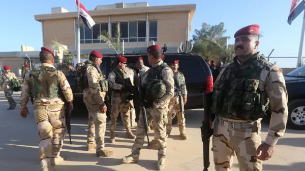 Iraqi army soldiers stand before a conference on fighting Daesh attended by Iraq's tribal leaders, militiamen and members of the government, at the Al-Asad air base, in Iraq's mainly Sunni Anbar province. (AFP/File)