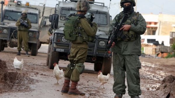 Israeli soldiers are seen during clashes with Palestinian protestors in the village of Qabatiya, near the West Bank town of Jenin on February 22, 2016. (AFP/Jaafar Ashtiyeh) Israeli soldiers are seen during clashes with Palestinian protestors in the village of Qabatiya, near the West Bank town of Jenin on February 22, 2016. (AFP/Jaafar Ashtiyeh)