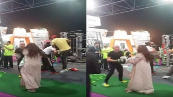 شاب يدرب فتاة على الملاكمة في جده