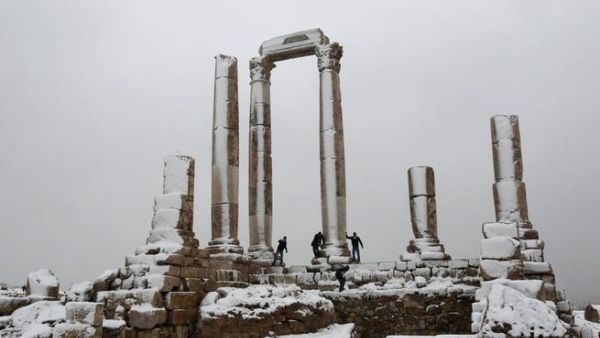 Men play after a snowstorm in January 2012 at the Amman Citidel. [wodumedia]