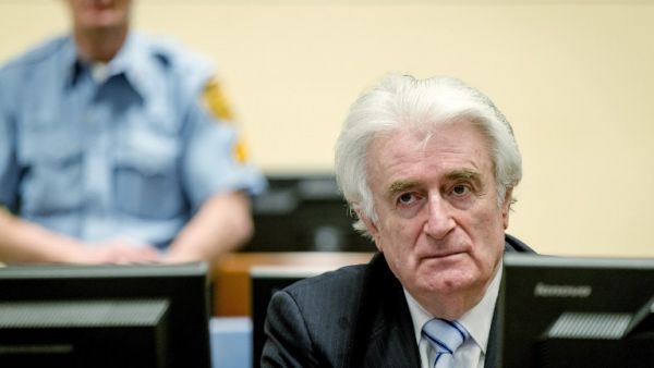 Bosnian Serb wartime leader Radovan Karadzic sits in the courtroom for the reading of his verdict at the International Criminal Tribunal for Former Yugoslavia (ICTY) in The Hague, on March 24, 2016. (AFP/Robin van Lonkhuijsen)