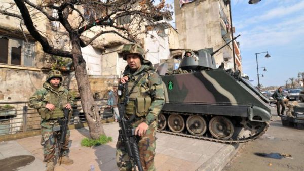 Lebanese soldiers are seen deployed on a street in the northern Lebanese city of Tripoli on March 14, 2014. (AFP/Ibrahim Shalhoub)