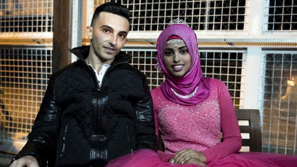 A Palestinian refugee from Lebanon and a Yemeni refugee pose for a photo during their engagement party at the Kofinou centre for refugees near the Cypriot coastal city of Larnaca. (AFP/File)