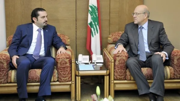 ميقاتي مجتمعا مع سعد الحريري خلال مشاورات التشكيل/أ.ف.ب