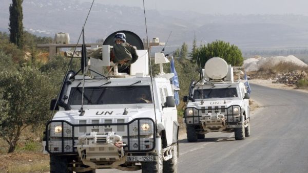 LEBANON, KFAR KILA : Peacekeepers of the United Nations Interim Force in Lebanon (UNIFIL) patrol along the Lebanese-Israeli border on August 23, 2013 in Kfar Kila after the Israeli air force launched a rocket toward a Palestinian group in Lebanon. AFP PHOTO MAHMOUD ZAYYAT