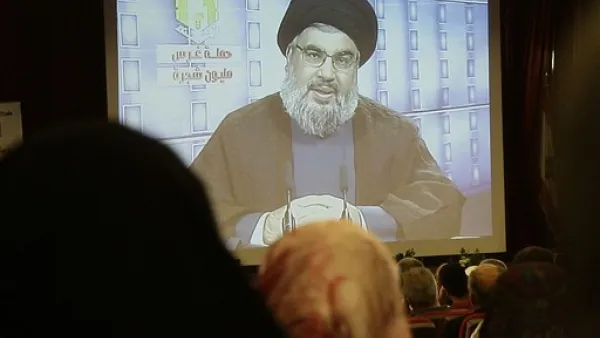 نصر الله يتحدث عبر شاشة خلال احتفال بيئي- ا.ف.ب