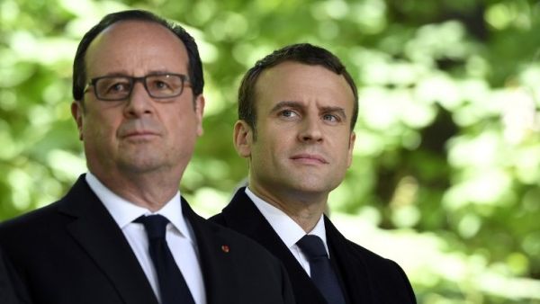 Then French President Francois Hollande (L) and French President-elect Emmanuel Macron at a special ceremony at the Jardin du Luxembourg, on May 10, 2017. (AFP/ Eric Feferberg) Then French President Francois Hollande (L) and French President-elect Emmanuel Macron at a special ceremony at the Jardin du Luxembourg, on May 10, 2017. (AFP/ Eric Feferberg)