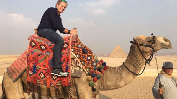 Bolton on a camel ride at Giza Plateau. (Ahram)