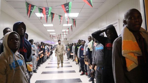 Migrants wait in line at the Metiga Airport in the Libyan capital Tripoli on March 11, 2016 ahead of their repatriation to their countries of origin by the Libyan authorities. (AFP/Mahmud Turkia)