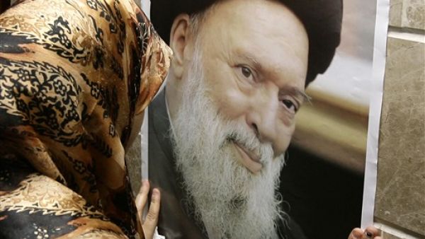 LEBANON, Beirut : A Shiite woman mourns the death of the late Grand Ayatollah Sayyed Mohammed Hussein Fadlallah (photo) at a mosque where his funeral is being held in Beirut's southern suburb on July 4, 2010, following his death earlier today at the age of 75 from internal bleeding an aide said. 