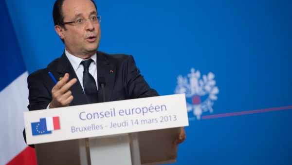 French President Francois Hollande attends a press conference at the EU Headquarters on Thursday in Brussels. (AFP PHOTO / BERTRAND LANGLOIS)
