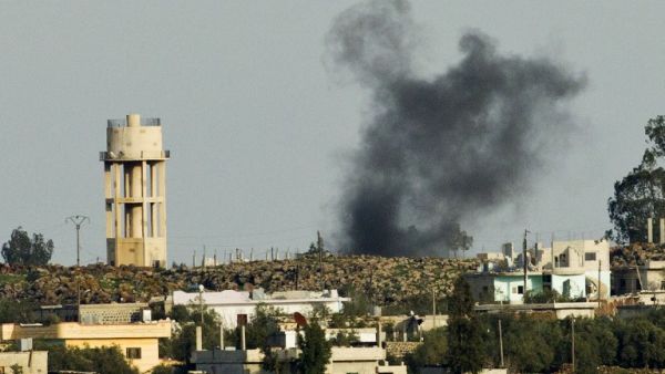 A picture taken from the Israeli side in the Golan Heights shows smoke after shells exploded in the Syrian village of al-Jamlah, close to the ceasefire line between Israel and Syria. (AFP PHOTO/JACK GUEZ)