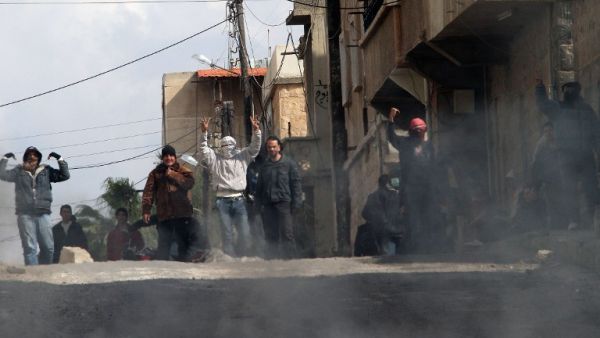 Anti-government protestors gesture on the streets of Dera'a, 100kms south of the capital Damascus. (AFP PHOTO/ANWAR AMRO)