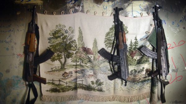 AK-47 machine guns hang in a shelter for Syrian rebels in the Salaheddine district of the northern Syrian city of Aleppo. (AFP PHOTO / DIMITAR DILKOFF) AK-47 machine guns hang in a shelter for Syrian rebels in the Salaheddine district of the northern Syrian city of Aleppo. (AFP PHOTO / DIMITAR DILKOFF)