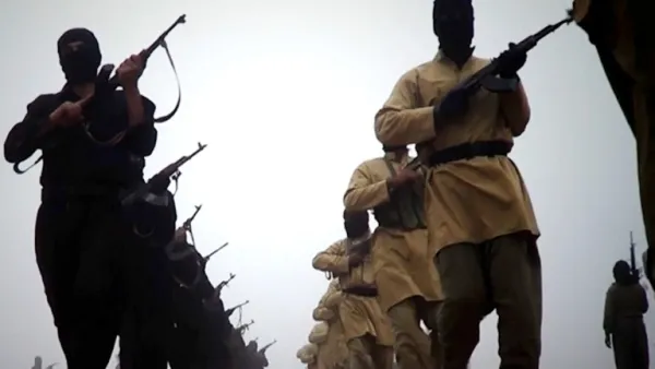 An image grab taken from a video released on January 4, 2014 by the Islamic State of Iraq and the Levant (ISIL)'s al-Furqan Media allegedly shows ISIL fighters marching at an undisclosed location. [AFP]