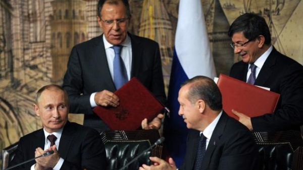 From left: Russian President Viladimir Putin, Russian Foreign Minister Sergei Lavrov, Turkish Prime Minister Recep Tayyip Erdogan and Turkish Foreign Minister Ahmet Davutoglu. Putin met Erdogan for talks covering their opposing views on Syria. (AFP PHOTO/BULENT KILIC)