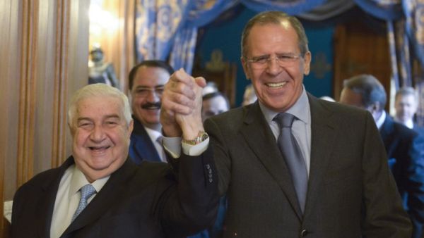 Russian Foreign Minister Sergei Lavrov (R) greets Syrian Foreign Minister Walid al-Moallem in Moscow, on January 17, 2014 during their meeting. [AFP]