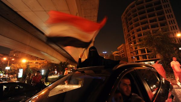 An Egyptian female supporter of the deposed president Mohamed Morsi waves a national flag during a demonstration against the government in Cairo on July 31, 2013. (AFP)