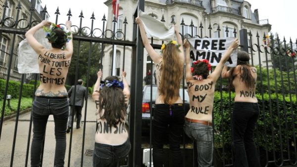 FEMEN activists protest outside the Tunisian embassy in Brussels on Thursday after three of their  bare-breasted companions get jailed in Tunis.