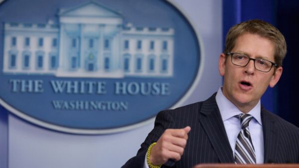 White House Press Secretary Jay Carney warned that if the new legislation to impose fresh sanctions on Tehran is enacted, “the president would veto it.” [Getty Images]