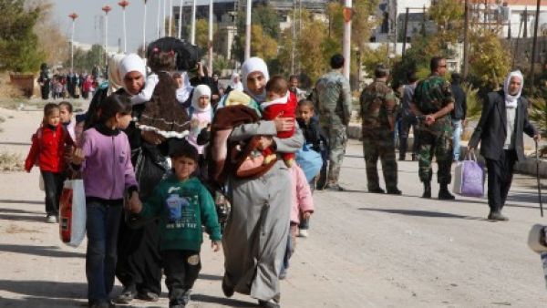 Approximately 3,000 women and children from Mouadamiya have managed to leave the besieged town according to UN figures (Khaled al-Hariri/Reuters)